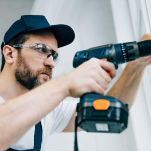adult-repairman-in-goggles-fixing-window-handle-by-electric-drill.jpg adult-repairman-in-goggles-fixing-window-handle-by-electric-drill.jpg